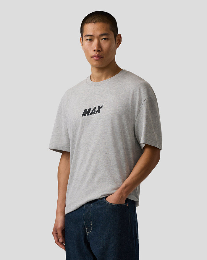 Model wearing grey marl Max Verstappen T Shirt with centered MAX logo and blue denim shorts.