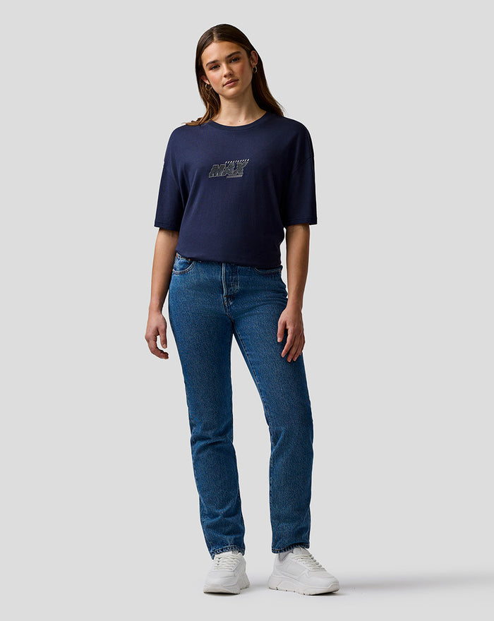 Female model wearing navy Max Verstappen logo T shirt with bold chest graphic and relaxed fit