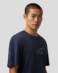 Male model in navy Max Verstappen T shirt with small chest logo seen in a closeup