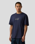 Full body shot of a male model wearing a navy Max Verstappen logo T shirt with centered chest graphic