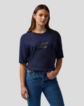 Female model wearing navy Max Verstappen logo T shirt with centered chest graphic shown from waist up