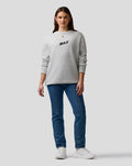 Full body shot of a female model in a grey marl Max Verstappen sweatshirt with MAX logo on the chest