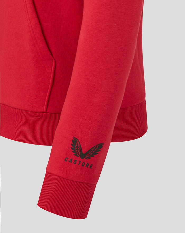 Close-up of the red hoodie sleeve showing the Castore logo near the cuff.
