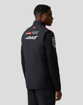 Back view of the Official Haas Team Unisex Gilet on a model showcasing Haas branding on the back
