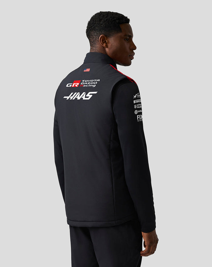 Back view of the Official Haas Team Unisex Gilet on a model showcasing Haas branding on the back