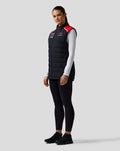 Model wearing Official Haas Team Unisex Gilet with red shoulder panels and full front zip.