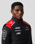 Close up of a male model wearing Official Haas Team Unisex Gilet with red shoulder panels and front branding