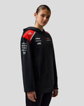 Official Haas Team black pullover hoodie with red shoulder panels and sponsor logos on chest and sleeves