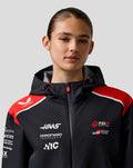 Detail shot of front zipper and sponsor logos on Haas Team jacket chest