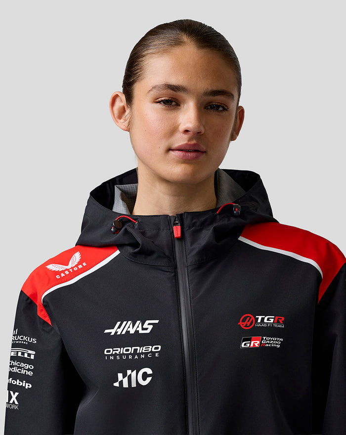 Detail shot of front zipper and sponsor logos on Haas Team jacket chest