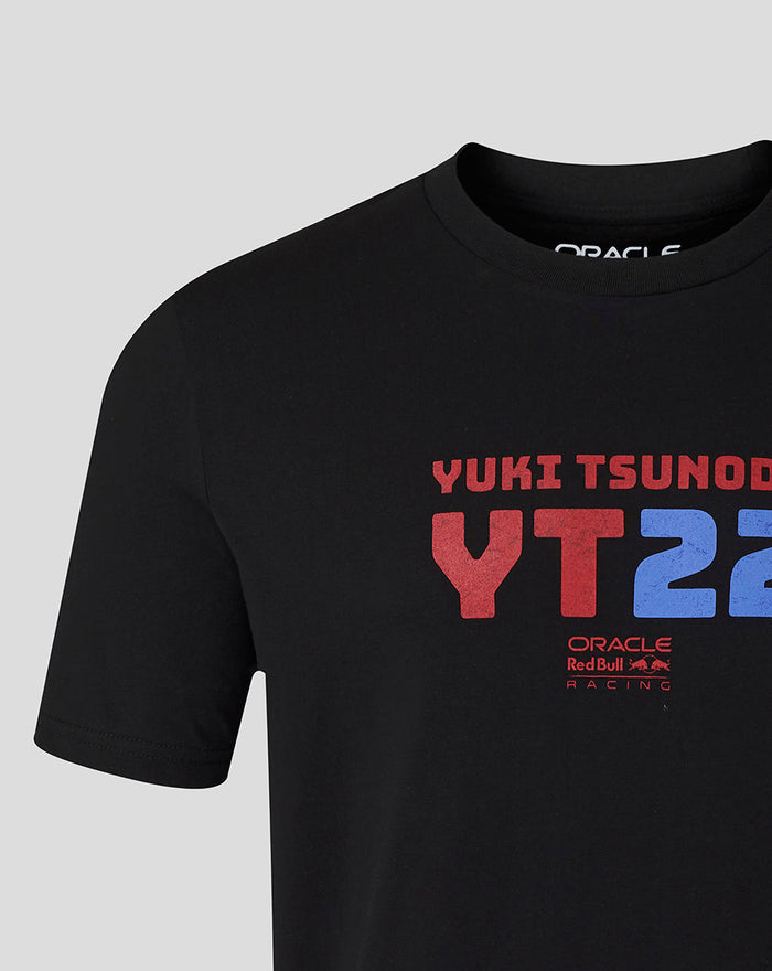 Close-up of black T shirt chest displaying YUKI TSUNODA and bold red and blue YT22 graphic with Oracle Red Bull Racing logo.
