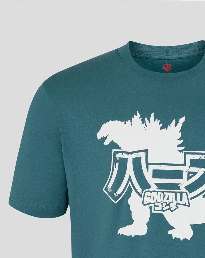 Close up of teal Godzilla x Haas T shirt front showing white graphics and typography