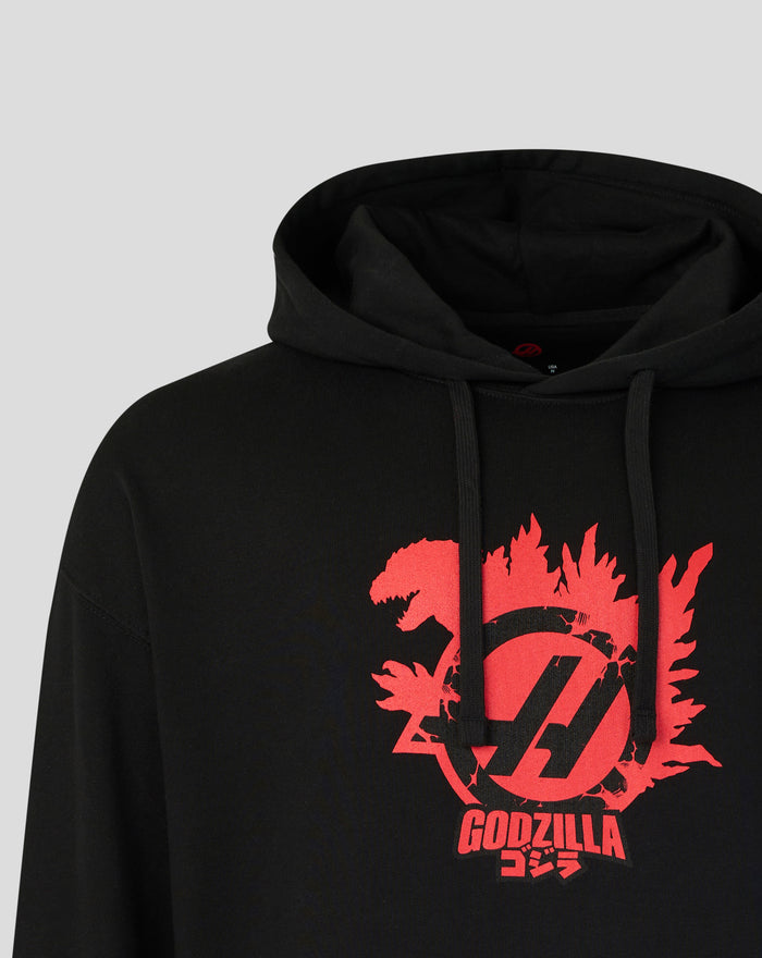 Close up of black Godzilla x Haas Team Hoodie with a red graphic on the chest and the hood visible