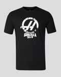 Front view of black Godzilla Comic X Haas T Shirt with a cracked white circular logo and Godzilla text