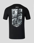 Back view of black Godzilla Comic X Haas T Shirt featuring a grayscale comic panel collage on the upper back