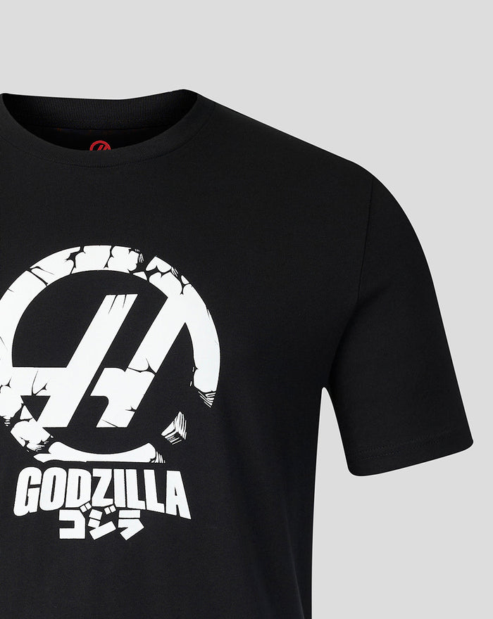 Back close-up of black Godzilla Comic X Haas T Shirt showing grayscale panels and TGR logo at the neckline