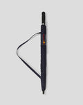 Folded navy Oracle Red Bull Racing umbrella with logo on strap