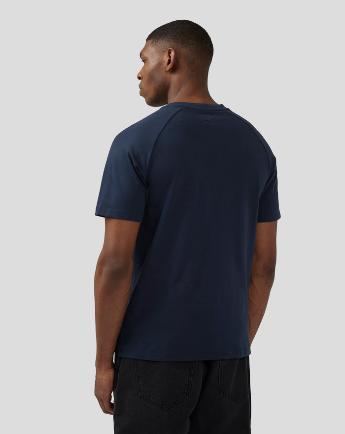 Back view of navy short sleeve T shirt with a small embossed logo at the upper back near the neckline.