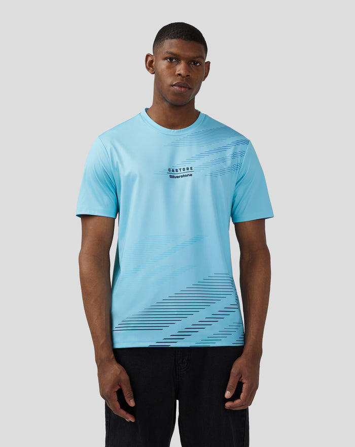 Front view of a man wearing a light blue Cabana Blue short sleeve T shirt with diagonal graphic across the chest