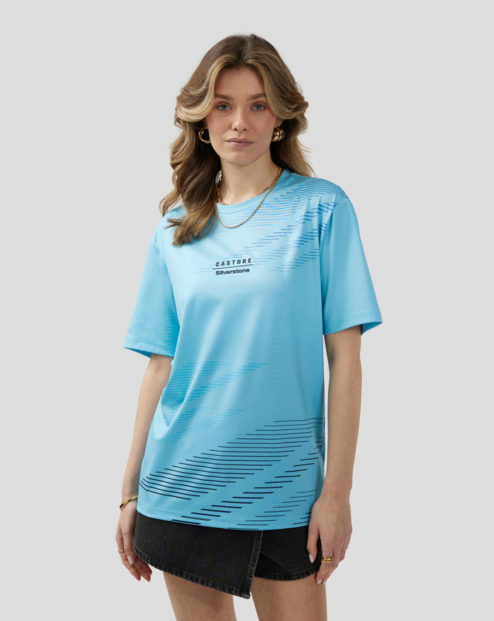 Front view of a woman wearing Cabana Blue Silverstone x Castore sublimated short sleeve T-shirt