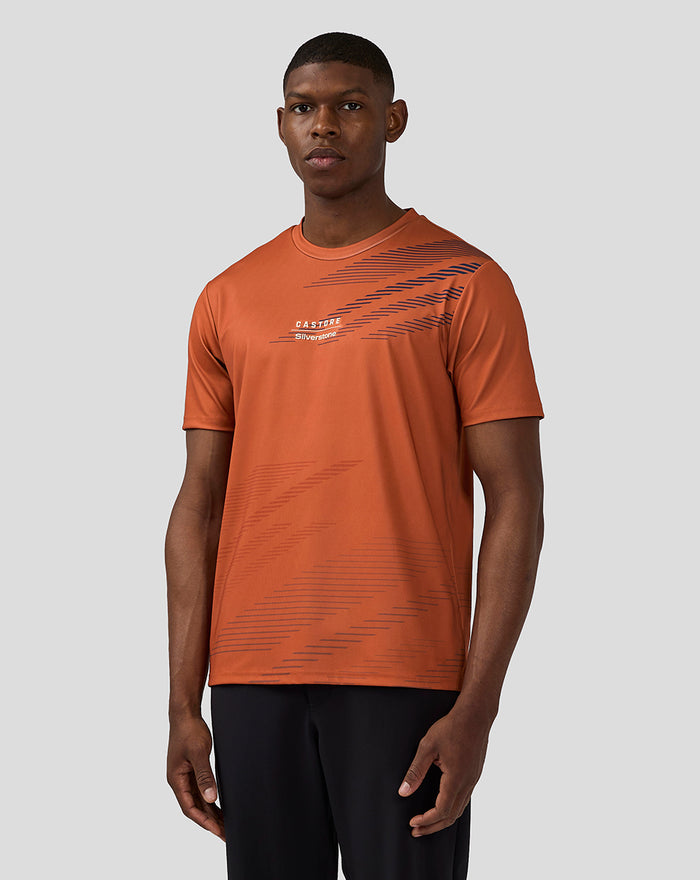 Front view of orange rust unisex Silverstone sublimated Short Sleeve T-Shirt with diagonal navy chest stripes and small logo.