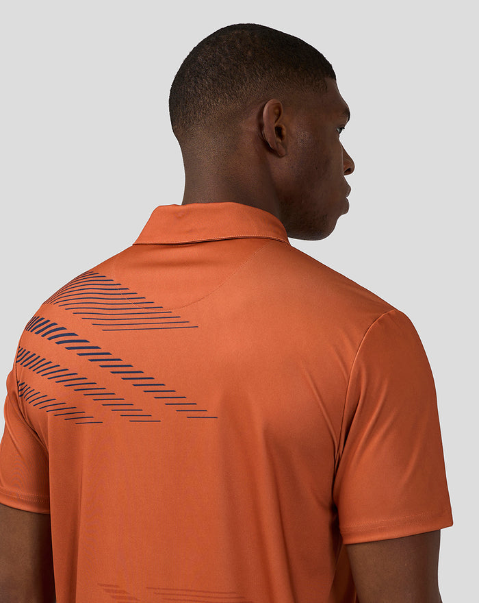 Back view of orange rust unisex sublimated short sleeve polo with navy diagonal lines.