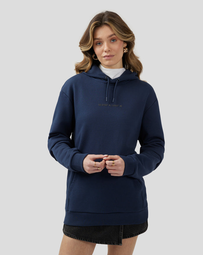 Unisex navy Silverstone Core Graphic Hoodie on a model featuring a front kangaroo pocket and drawstrings