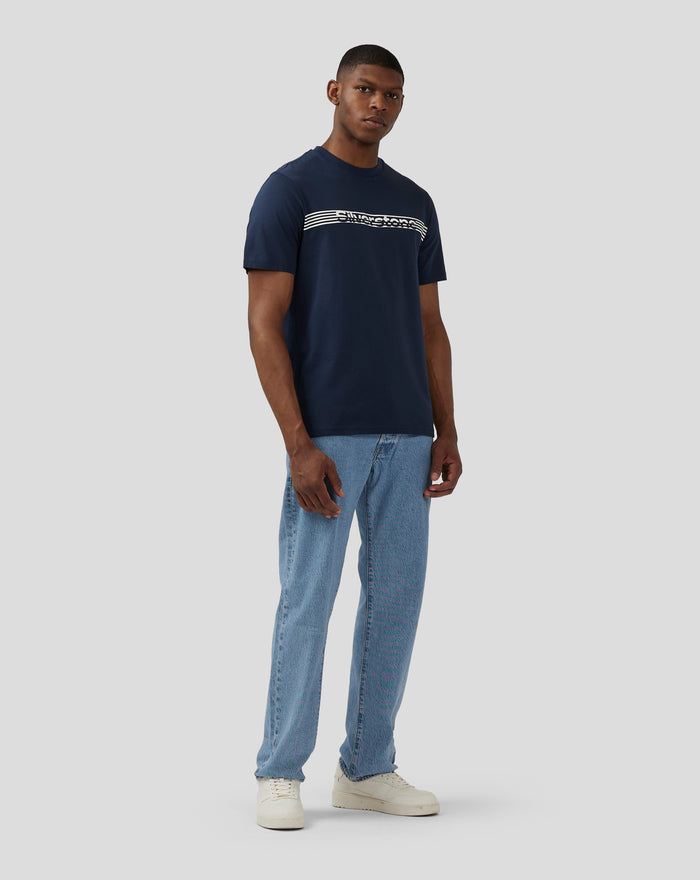 Male model in navy Silverstone Core T Shirt with white graphic across chest