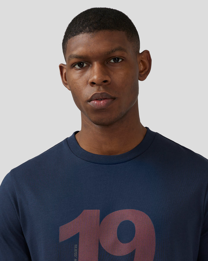 Close-up of a model wearing a Black Iris Silverstone Core 1948 T-Shirt with a large two-tone center front print on navy jersey