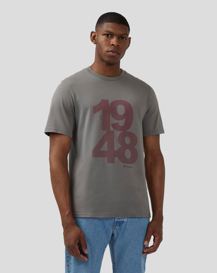 Front view of a model wearing the Unisex Silverstone Core 1948 T-Shirt in charcoal grey with a large two tone chest print