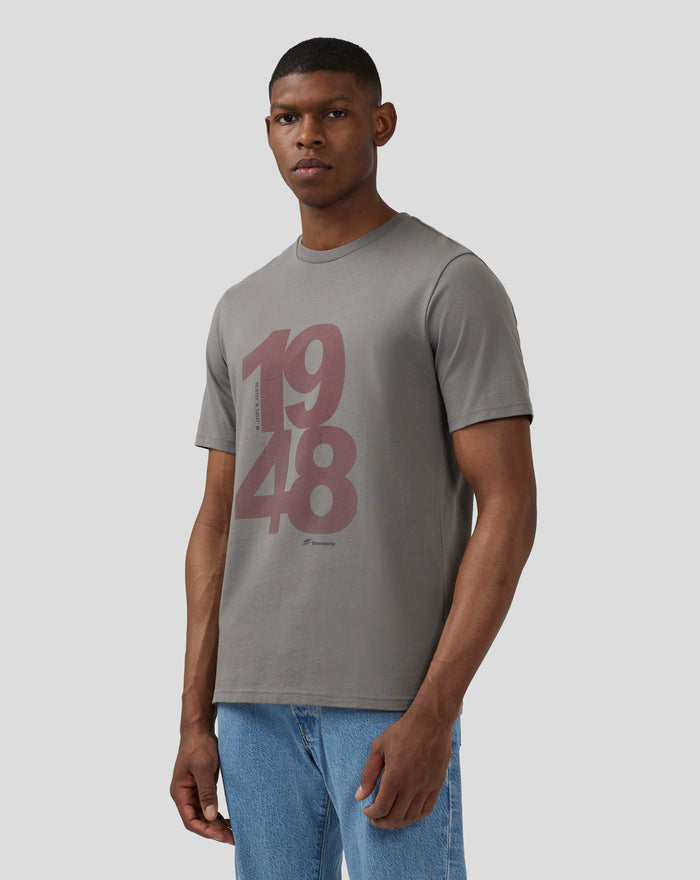 Front view of a male model wearing a charcoal grey Silverstone Core 1948 T Shirt with a bold two tone chest graphic.