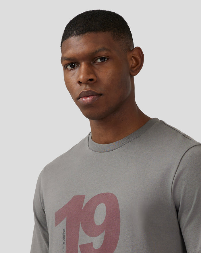 Close up of a male model wearing a charcoal grey Silverstone Core 1948 T Shirt with a centered two tone chest print.