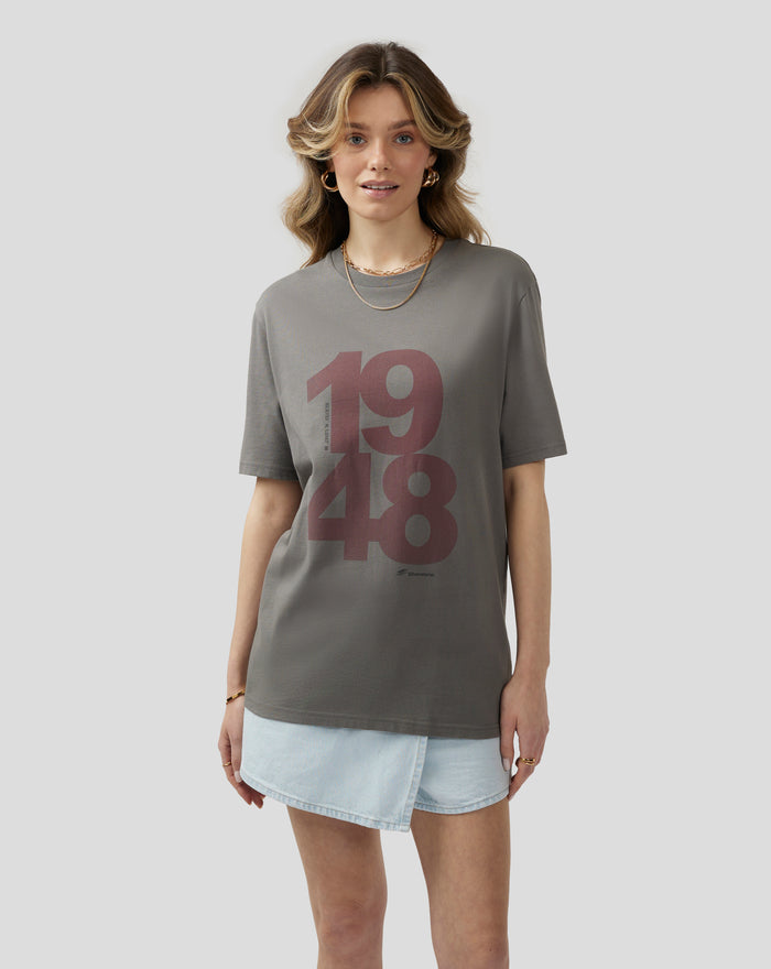 Female model wearing charcoal grey Unisex Silverstone Core 1948 T shirt with large burgundy front graphic