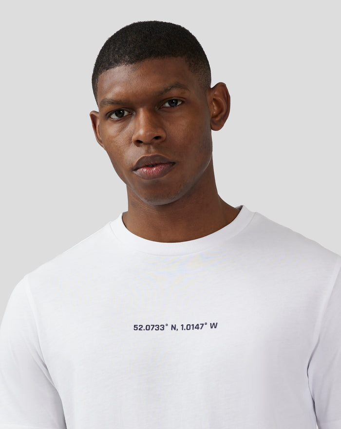Front view of white unisex T shirt with coordinates printed across the chest