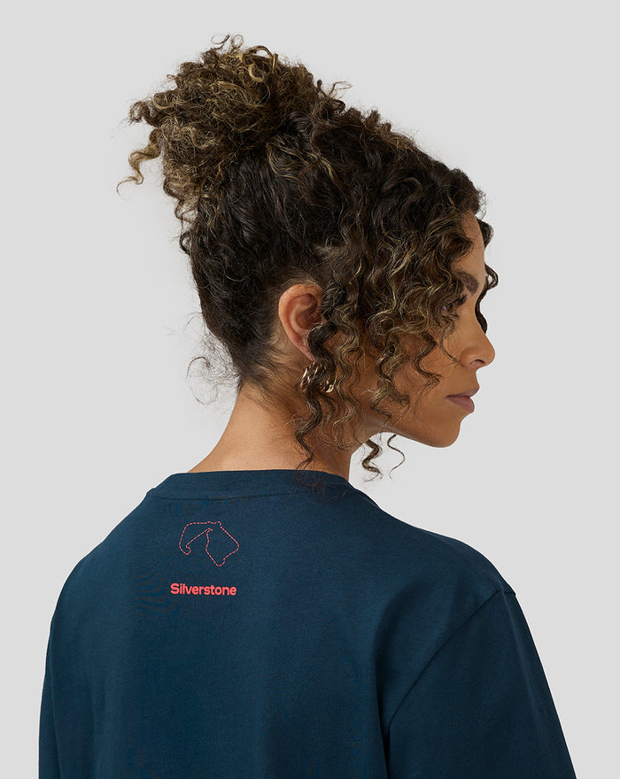 Back view of Black Iris Unisex Silverstone x Castore Coordinate Graphic T-Shirt showing pink logo and map outline on the upper back.