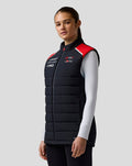 Woman wearing the Official Haas Team Unisex Gilet with navy quilted body and red shoulder panels